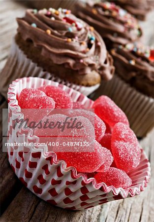 Red heart jelly sweets and chocolate cupcakes