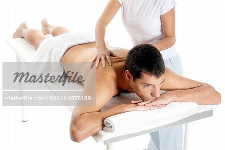 Man receiving massage relax treatment from female hands