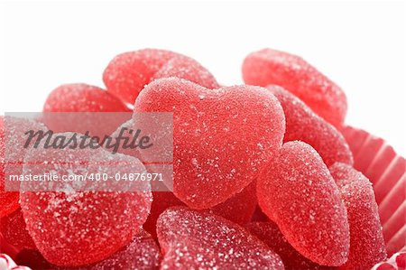 Red heart shaped jelly sweets on a white background
