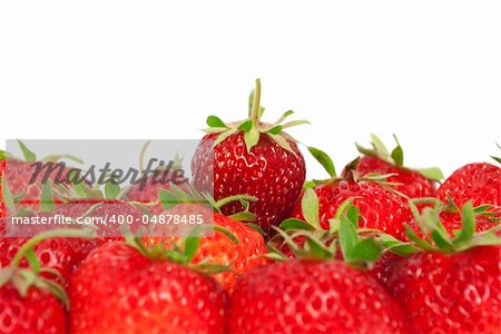 Ripe juicy strawberries on the white background