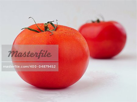 beautiful red tomatoes with drops of water