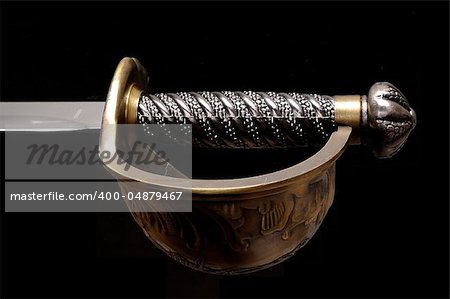 Sword hilt pommel blade and handle isolated over black