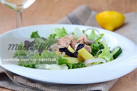 Traditional salad nicoise with fish, onions and potatoes