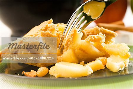 fresh homemade apple pie over green glass dish macro colseup eating  with fork