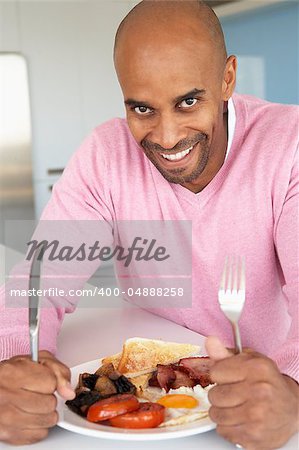 Middle Aged Man Eating Unhealthy Fried Breakfast