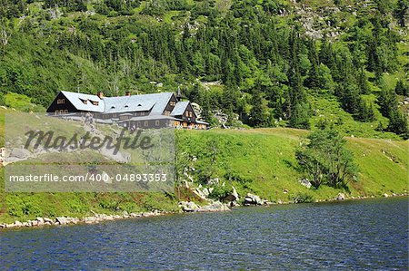 Shelter Samotnia and lake Maly Staw in polish mountains Karkonosze