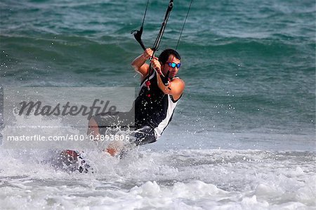 Kiteboarder enjoy surfing in ocean. Vietnam