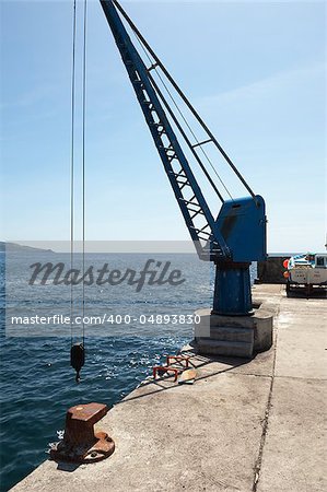 Port crane in a small harbor, Pico, Azores