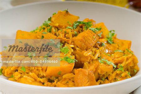 fresh home made curry beef rice and potatoes with ingredients around composition