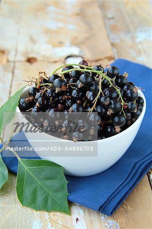 black currants ripe and natural on a wooden table