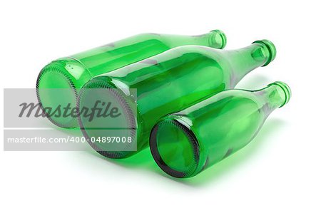 Three green glass bottles on white background