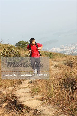 Sport hiking in mountains, walking and backpacking , the man in motion blur