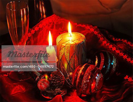 christmas collage with burning candles, decorative balls and glass