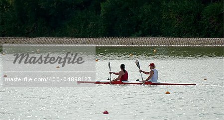 Two rowers in a boat in line