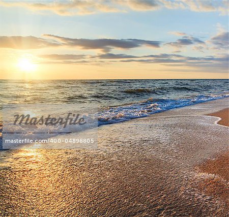 Sea  sunset surf great wave break on sandy coastline