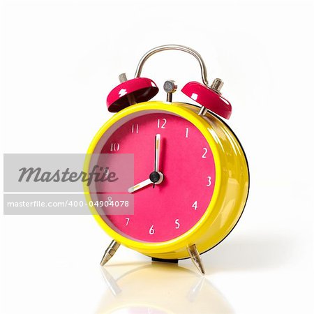 pink and yellow color clock on a white background