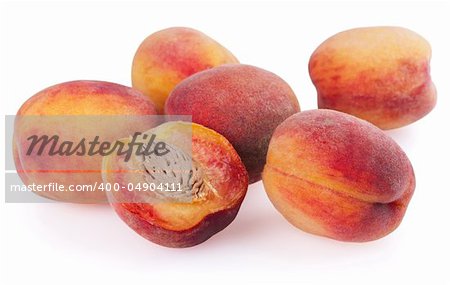 Many ripe peaches isolated on a white background