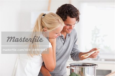 Couple tasting a meal in a boiler