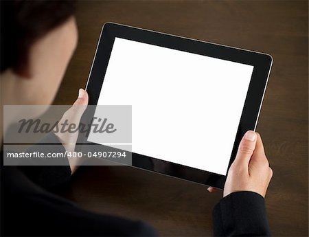 Business woman holding blank touch screen device.