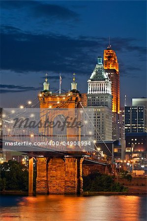 Image of Cincinnati cityscape and bridge at night.