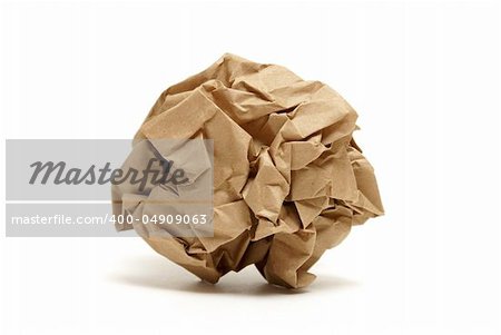 A crumpled piece of brown paper isolated on a white background.