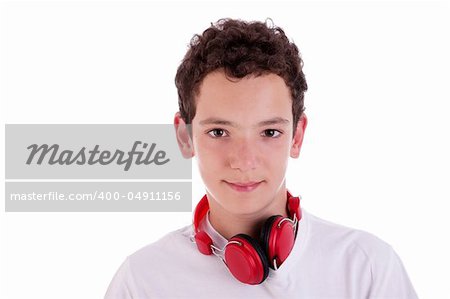 young man standing listening to music on red headphones, isolated on white, studio shot