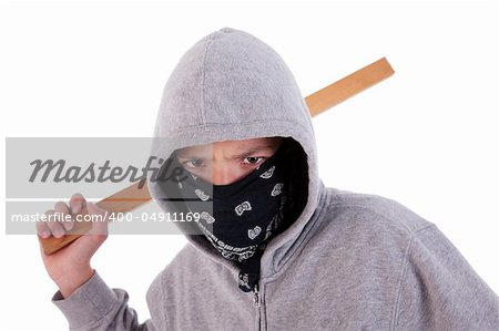A teen with a stick, in a act of juvenile delinquency, in white background, studio session