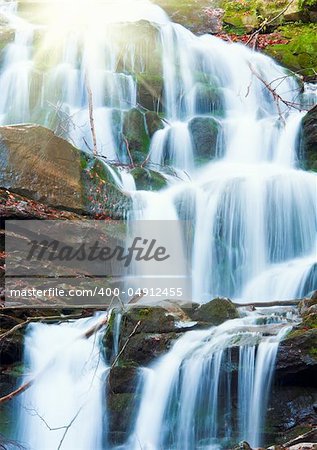 Waterfalls on Rocky Stream, Running Through Autumn Mountain Forest, and sunshine