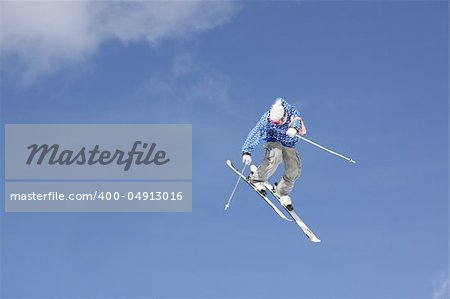 flying skier on mountains, in the sky