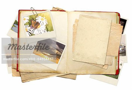 Old book and photos. Objects isolated over white