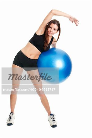 Fitness woman posing with fitness ball. Isolated on white