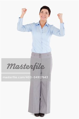 Businesswoman with the fists up against a white background