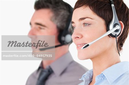 Close up of operators using headsets against a white background