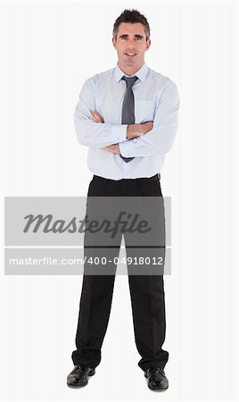 Businessman with his arms crossed against a white background