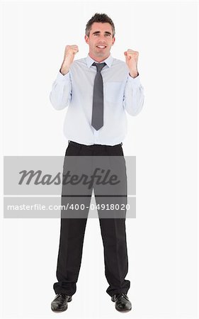Cheerful businessman with the fists up against a white background