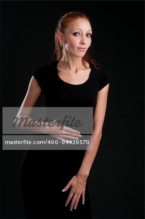 Portrait of the beautiful woman. Dark background