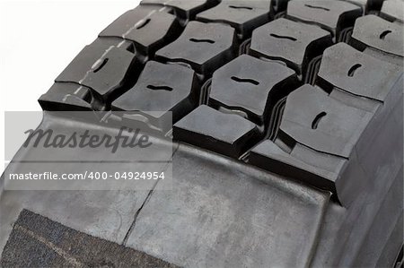 modified tire from a lorry isolated on white. Half with, the other without tread pattern.