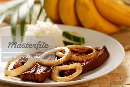 Steak de porc avec du riz (bonhomme Tagalog). Plat philippin traditionnel