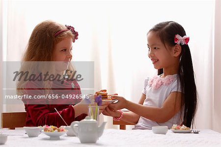 two young girls having a tea party