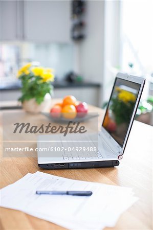 Laptop on kitchen table