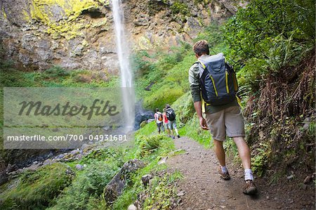 Four Friends Hiking near Waterfall, Columbia River Gorge, near Portland, Oregon, USA