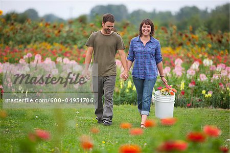Couple Picking Flowers, Sauvie Island, Oregon, USA