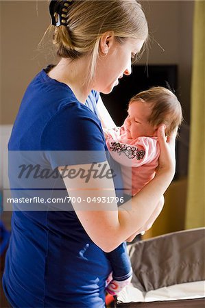 Frau Holding Baby Girl