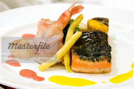 Steamed red snapper with shrimps. Fillet of salmon with crusted fine herbs and scallops. Crabmeat timbale served with baby vegetables and lobster sauce.