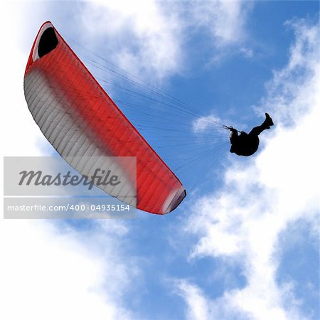 man with paraplane flying in the sky