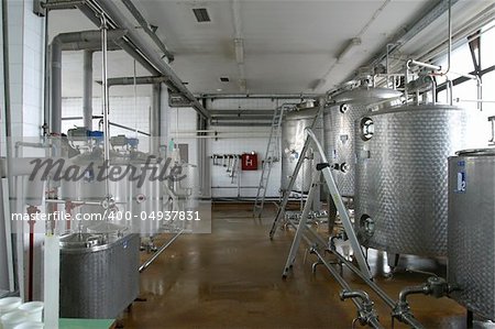stainless steel pipes and tanks in dairy food production plant