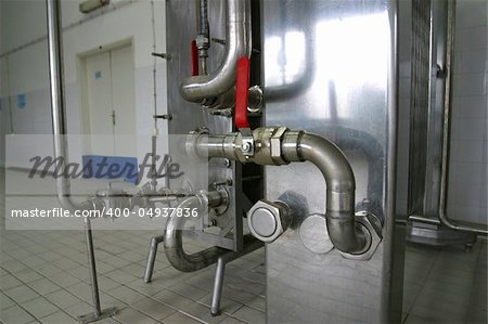 pipes and pressure valves  in dairy produce factory