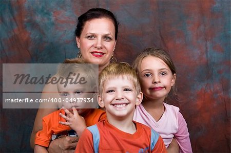 proud grandmother of three, surrounded by the grandchildren