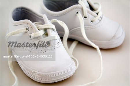 White Little Baby Shoes Isolated on a Background