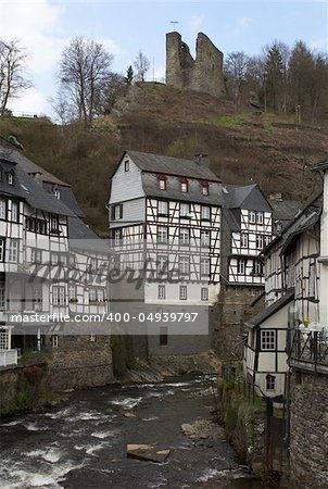 Historic center of Monschau at the Rur river. Above the city is the castle Monschau, which dates back to the 13th century.